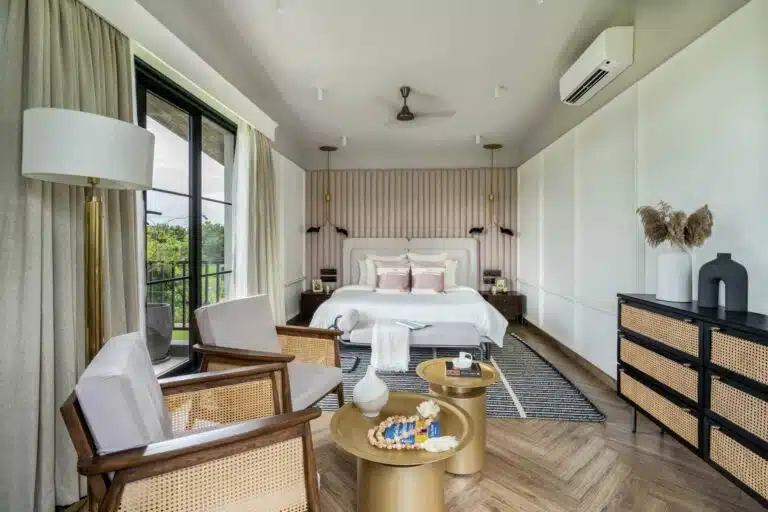 Spacious bedroom with elegant interiors at Riyuvann Estate luxury villa in Alibaug