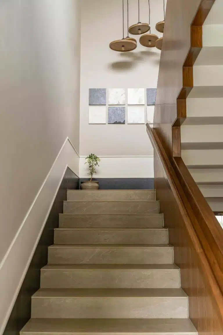 Grand staircase with contemporary design at Riyuvann Estate luxury villa in Alibaug